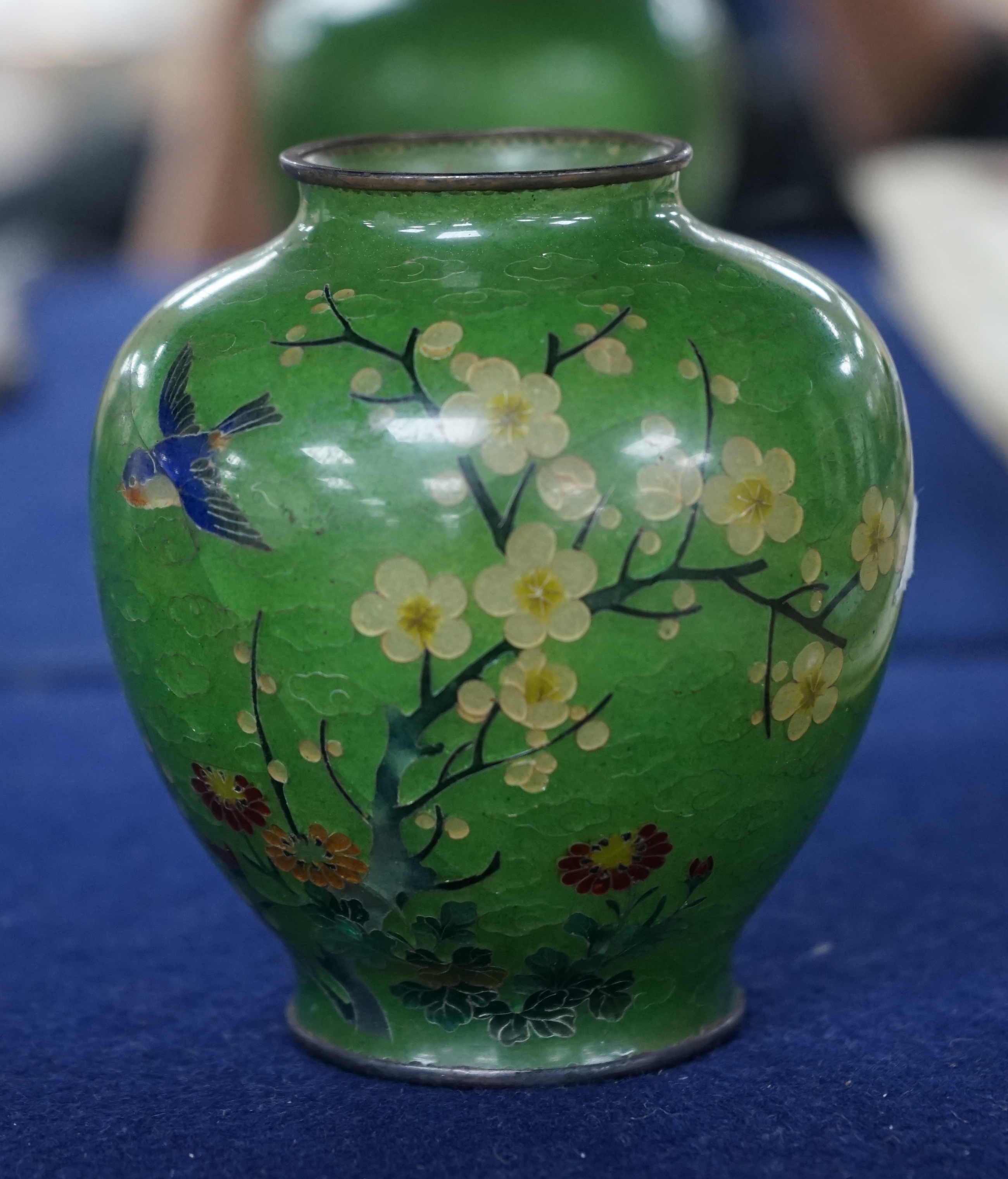 A Japanese silver wire plique a jour enamel green ground vase, early 20th century, 8.5cm. Condition - large cracks to body otherwise reasonable